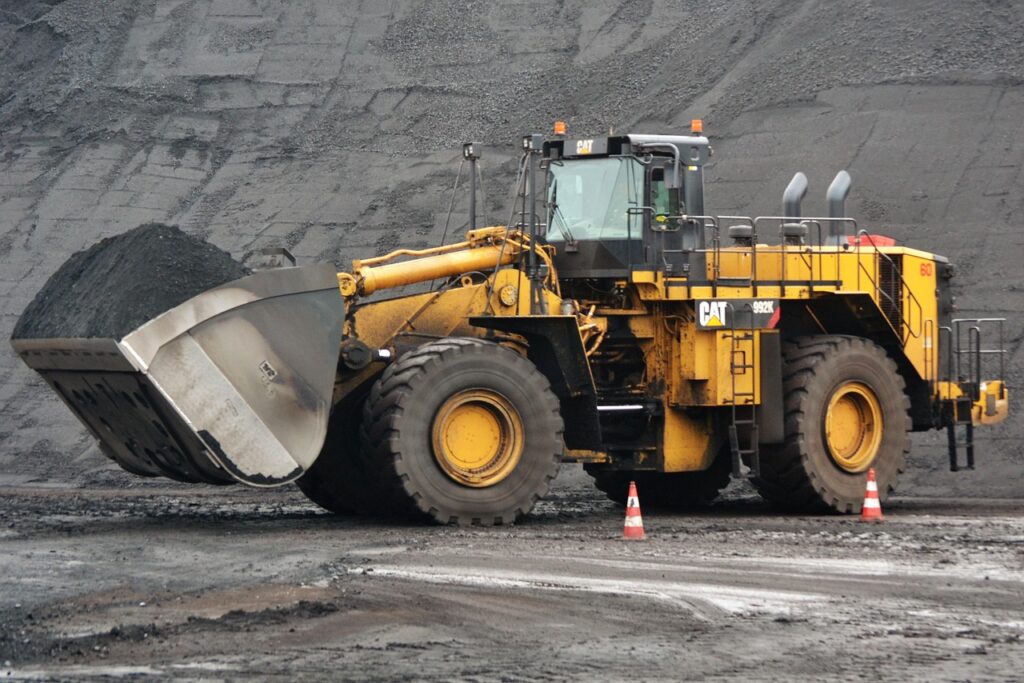 Bulldozers push large volumes of material, level ground, and prep sites for other work. Whether it’s road building, mining, or grading, they’re foundational to heavy construction.